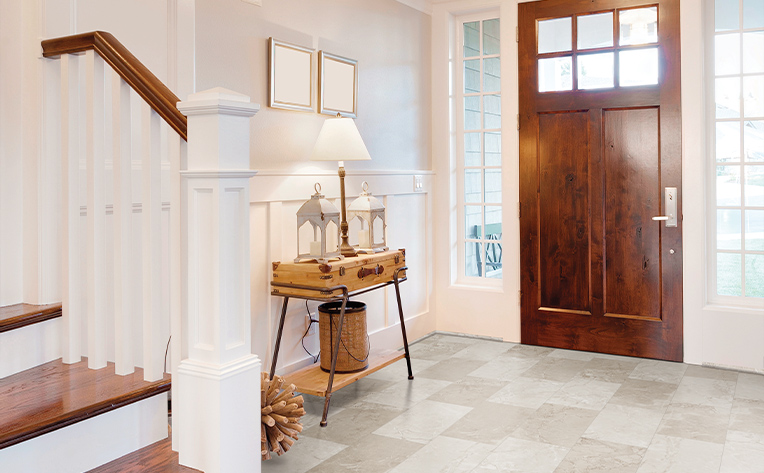 entryway with wooden door